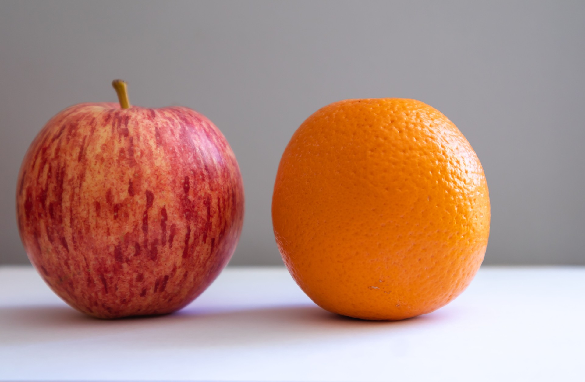 Apple and orange side-by-side comparison